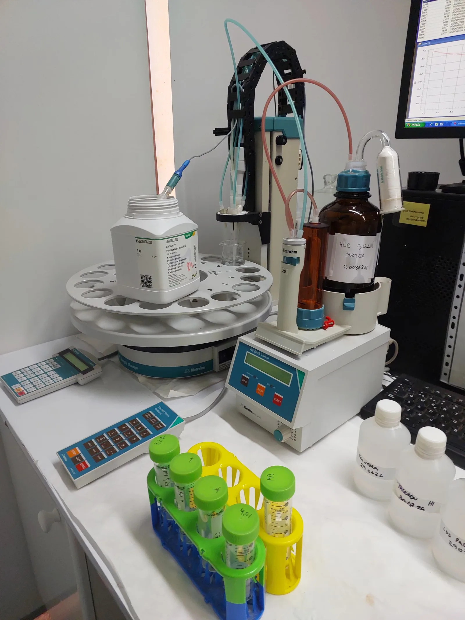Analytical laboratory instruments including a precision balance and spectrophotometer