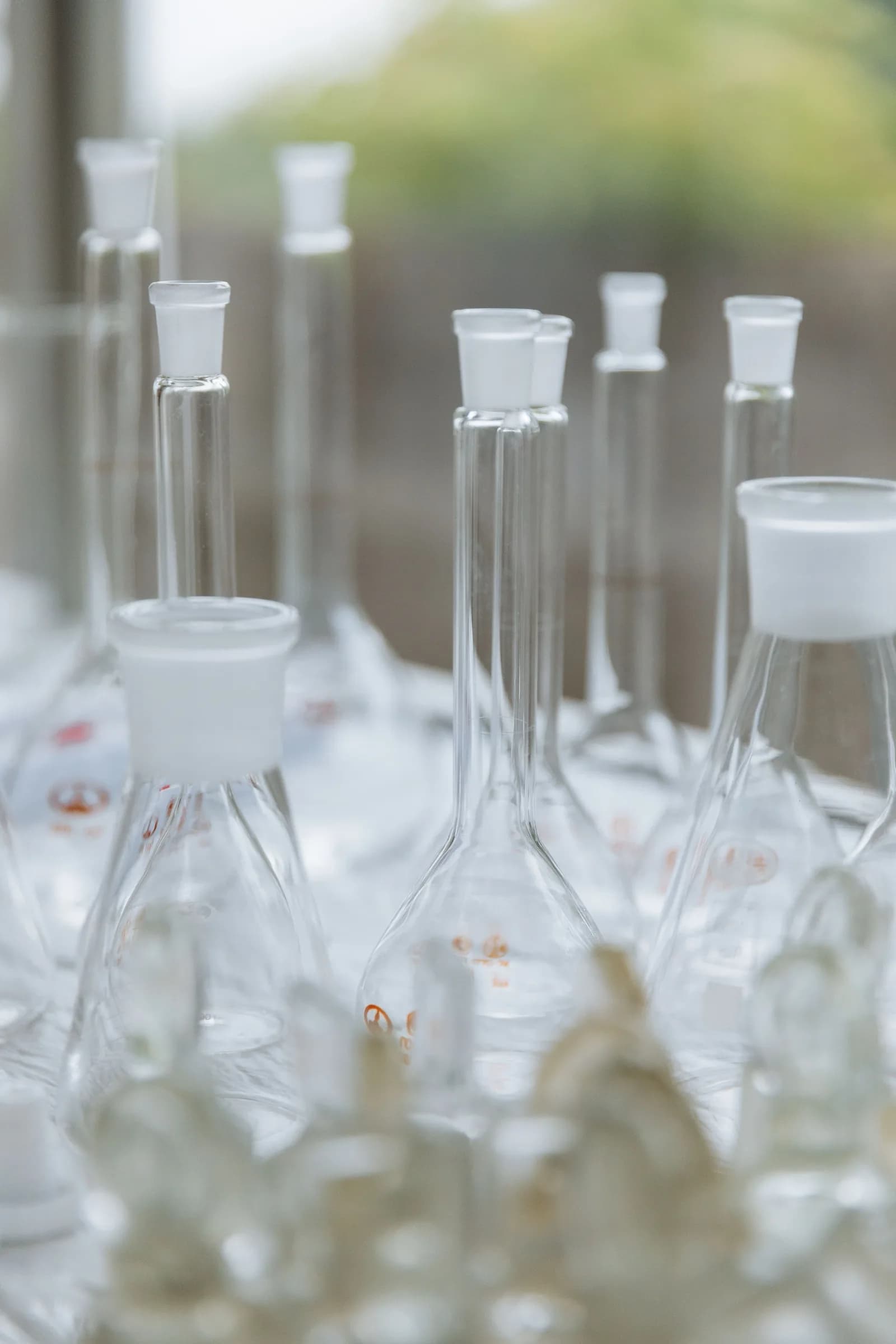 Borosilicate laboratory glassware including volumetric flasks and burettes
