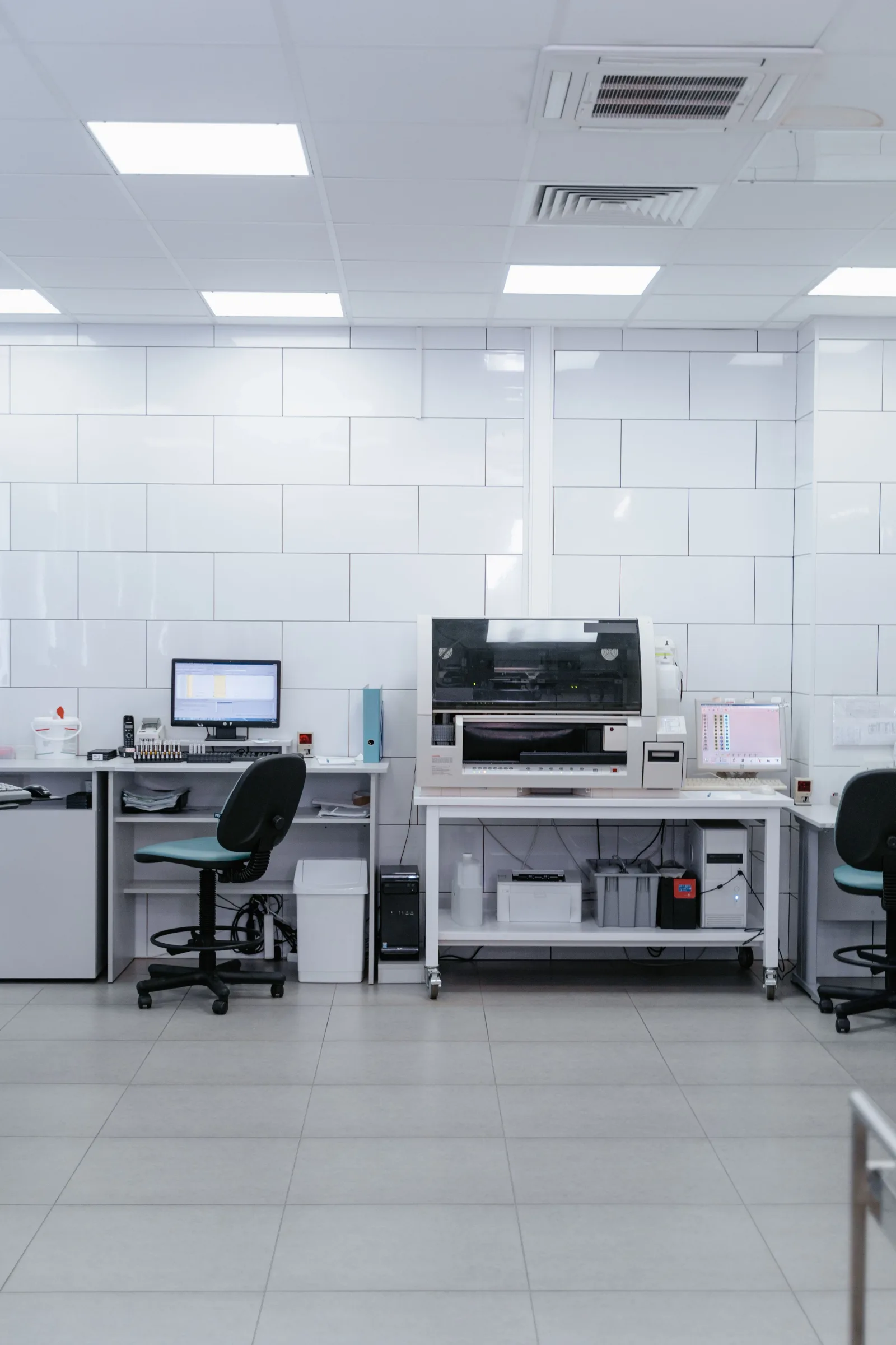 Laboratory bench with borosilicate glassware and an analytical balance